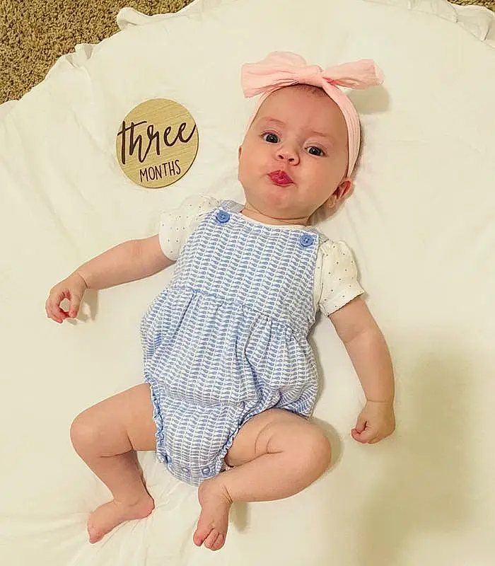 Face, Skin, Head, Lip, Chin, Eyes, Baby & Toddler Clothing, Human Body, Textile, Sleeve, Baby, Pink, Pattern, Toddler, Happy, Day Dress, Thigh, Thumb, Barefoot, Person, Headwear