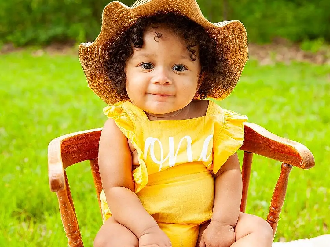 Skin, Head, Smile, Leg, Plant, Hat, Shorts, Human Body, Fedora, Sun Hat, People In Nature, Chair, Baby & Toddler Clothing, Happy, Baby, Thigh, Toddler, Grass, Leisure, Summer, Person
