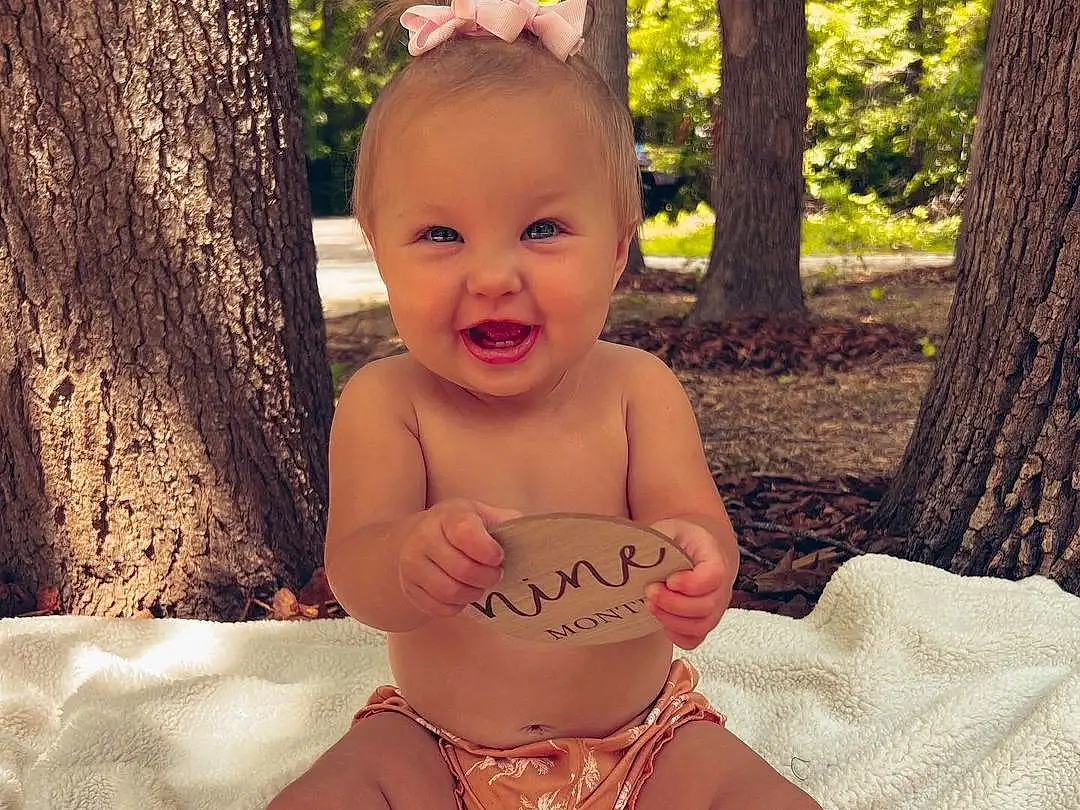 Face, Skin, Smile, Head, Eyes, Stomach, People In Nature, Tree, Happy, Baby, Grass, Pink, Baby & Toddler Clothing, Finger, Toddler, Shorts, Summer, Trunk, Fun, Chest, Person