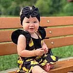 Smile, Happy, Baby & Toddler Clothing, Yellow, Outdoor Bench, Wood, Finger, People In Nature, Thigh, Outdoor Furniture, Toy, Bench, Grass, Leisure, Child, Toddler, Sitting, Fun, Human Leg, Thumb