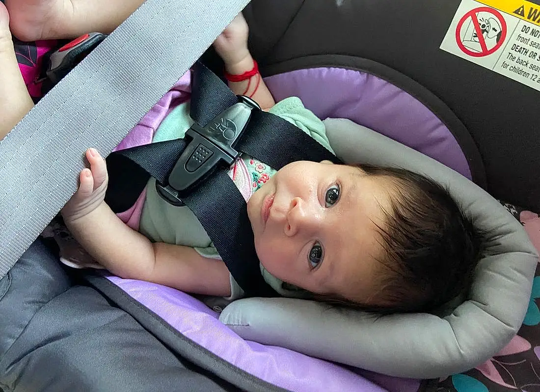 Skin, Comfort, Purple, Baby Carriage, Seat Belt, Gesture, Car Seat, Finger, Pink, Violet, Toddler, Baby In Car Seat, Baby, Auto Part, Baby Products, Grass, Baby & Toddler Clothing, Child, Fashion Accessory, Person