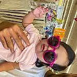 Skin, Hand, Arm, Mouth, Sunglasses, Goggles, Vision Care, Eyelash, Finger, Nail, Toddler, Thigh, Service, Baby, Thumb, Medical Procedure, Child, Wrist, Medical Equipment, Patient, Person