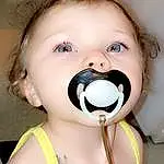 Nose, Cheek, Skin, Head, Lip, Chin, Facial Expression, Mouth, Eyelash, Ear, Neck, Happy, Iris, Toy, Pink, Child, Audio Equipment, Toddler, Baby & Toddler Clothing, Fun, Person