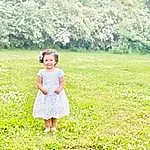 Plant, Green, People In Nature, Leaf, Tree, Flower, Happy, Vegetation, Grass, Natural Landscape, Toddler, Grassland, Groundcover, Landscape, Meadow, Baby & Toddler Clothing, Day Dress, Prairie, Smile, Person, Joy