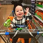 Smile, Shelf, Shopping Cart, Retail, Toddler, Customer, Fun, T-shirt, Shopping, Service, Convenience Store, Cart, Child, Toy, Baby, Supermarket, Grocery Store, Room, Person, Joy, Headwear