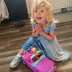 Smile, Wheel, Riding Toy, Purple, Dress, Tire, Pink, Toddler, Child, Wood, Happy, Toy, Baby & Toddler Clothing, Fun, Leisure, Blond, Sitting, Magenta, Event, Person
