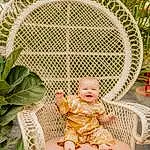 Plant, Terrestrial Plant, Smile, Chair, Grass, People In Nature, Baby & Toddler Clothing, Baby, Toddler, Happy, Pattern, Circle, Leisure, Sitting, Tree, Outdoor Furniture, Symmetry, Garden, Arch, Child, Person, Joy
