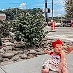 Sky, Cloud, Plant, Infrastructure, Road Surface, Asphalt, Line, Red, Public Space, Sidewalk, Tree, Road, Summer, Baby & Toddler Clothing, City, Toddler, Baby, Travel, Street, Person, Headwear