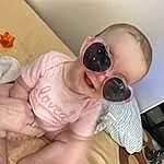 Skin, Baby, Goggles, Pink, Baby & Toddler Clothing, Toddler, Child, Comfort, Sunglasses, People, Eyewear, Fun, Baby Products, Room, Happy, Nail, Personal Protective Equipment, Chest, Thumb, Person