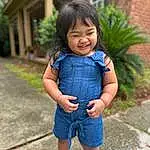 Hair, Face, Skin, Head, Plant, Outerwear, Smile, Eyes, Dress, Baby & Toddler Clothing, Sleeve, Happy, Grass, Leisure, Toddler, Denim, Child, Electric Blue, Tree, T-shirt, Person, Joy