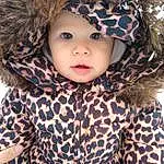 Clothing, Outerwear, Photograph, Eyes, White, Textile, Sleeve, Headgear, Jacket, Toddler, Baby & Toddler Clothing, Cap, Beauty, Pattern, Furry friends, Tree, Fashion Accessory, Hood, Winter, Child, Person, Headwear