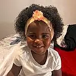 Smile, Cheek, Skin, Lip, Eyebrow, Eyes, Facial Expression, Flash Photography, Happy, Headgear, Black Hair, Baby & Toddler Clothing, Toddler, Afro, Fun, Child, Comfort, Headpiece, Thigh, Hair Accessory, Person, Joy