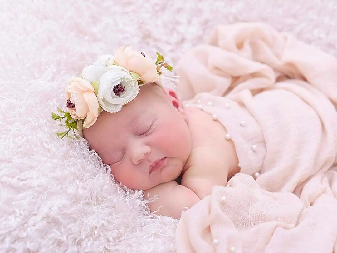 Hand, Baby & Toddler Clothing, Flower, Baby, Pink, Embellishment, Petal, Headpiece, Baby Sleeping, Headband, Toddler, Jewellery, Happy, Hair Accessory, Cap, Fashion Accessory, Linens, Peach, Grass, Rose, Person