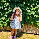 Clothing, Plant, People In Nature, Hat, Green, Leaf, Botany, Happy, Day Dress, Grass, Sun Hat, Grassland, Waist, Pattern, Beauty, Eyewear, Lawn, Leisure, Electric Blue, Person