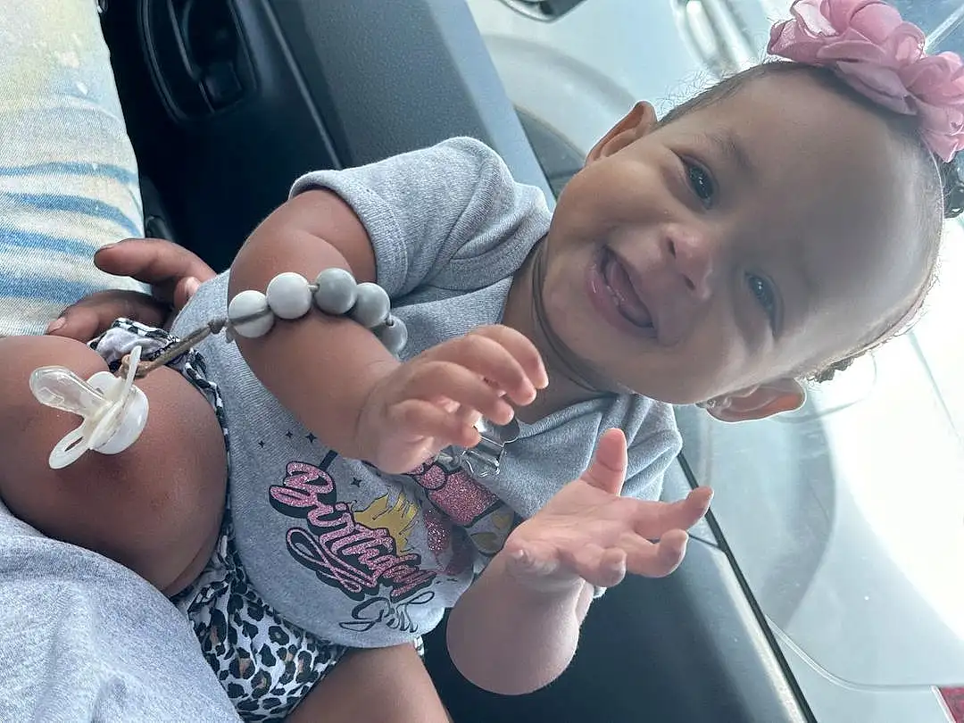Skin, Facial Expression, Smile, Mouth, Muscle, Happy, Gesture, Finger, Cool, Thumb, Thigh, Toddler, Summer, Eyewear, Nail, Trunk, Chest, Vehicle Door, Baby, Child, Person, Joy