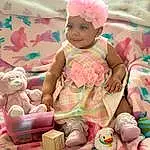Skin, Smile, Photograph, Facial Expression, Toy, Textile, Baby, Pink, Fun, Baby & Toddler Clothing, Toddler, Child, Happy, People, Baby Products, Play, Room, Event, Person, Joy, Headwear
