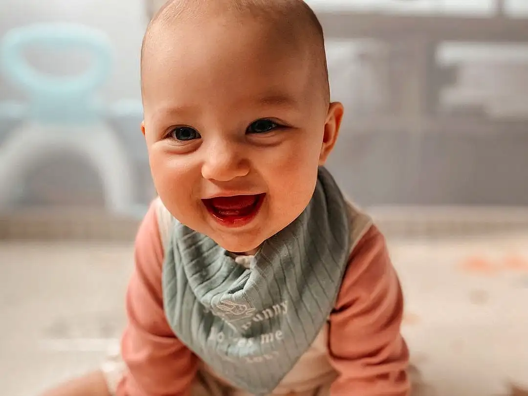 Nose, Smile, Cheek, Skin, Lip, Chin, Hand, Facial Expression, Mouth, Wood, Sleeve, Happy, Baby & Toddler Clothing, Gesture, Dress, Finger, Baby, Toddler, Person